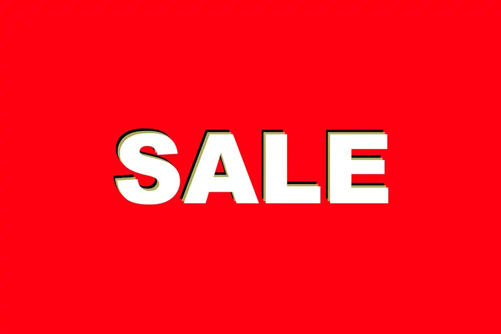 The word 'SALE' is displayed in large, bold white letters with a black outline and a subtle drop shadow, set against a solid bright red background.